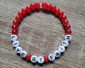 RED LIVE BY FAITH BRACELET